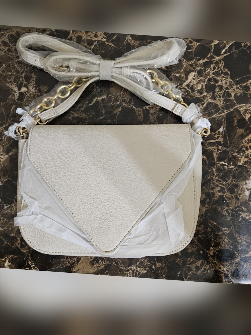 Cream V-shaped Bag with Gold Chain Accent